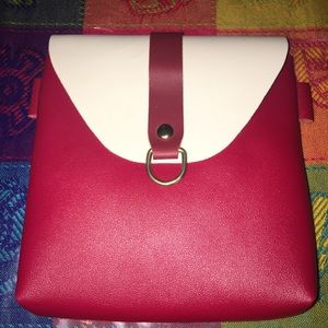 Handbag with arm strap